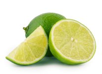 Whole and sliced sour lime isolated on white background